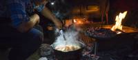 The Larapinta Guides still cook with traditional camp ovens over an open fire | Caroline Crick