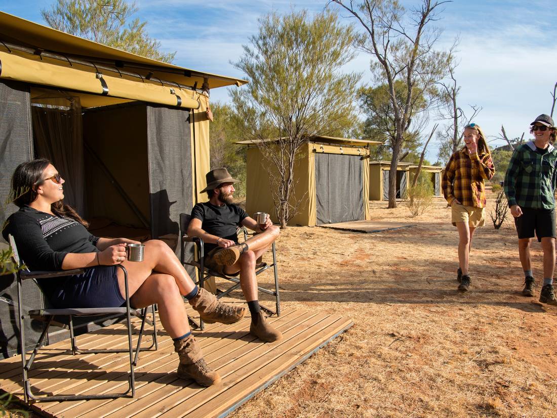 Trekkers relaxing on the porch of their campsites |  <i>Shaana McNaught</i>