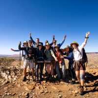 Happy hikers at Euro Ridge on the Larapinta Trail | Shaana McNaught