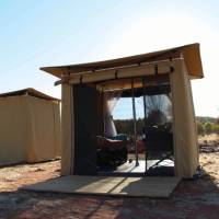 Sleeping tents at Nick's Camp on the Larapinta Trail with both windows open for an outdoor sleeping experience. | Ayla Rowe