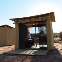 Sleeping tents at Nick's Camp on the Larapinta Trail with both windows open for an outdoor sleeping experience. |  <i>Ayla Rowe</i>